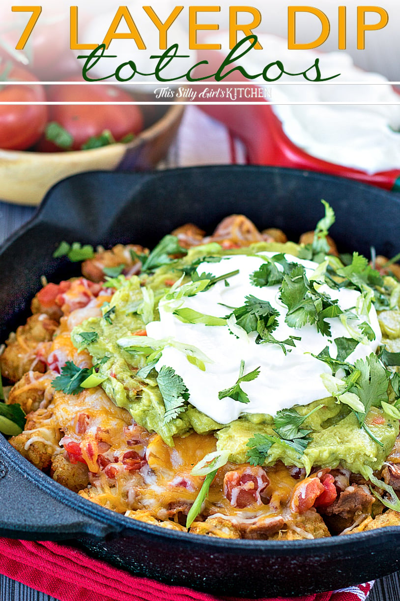 7 Layer Dip Totchos, taking classic 7 layer dip and tater tots to next level deliciousness! #recipe from thissillygirlskitchen.com #totchos #nachos #sevenlayerdip #7layerdip #totchosnachos