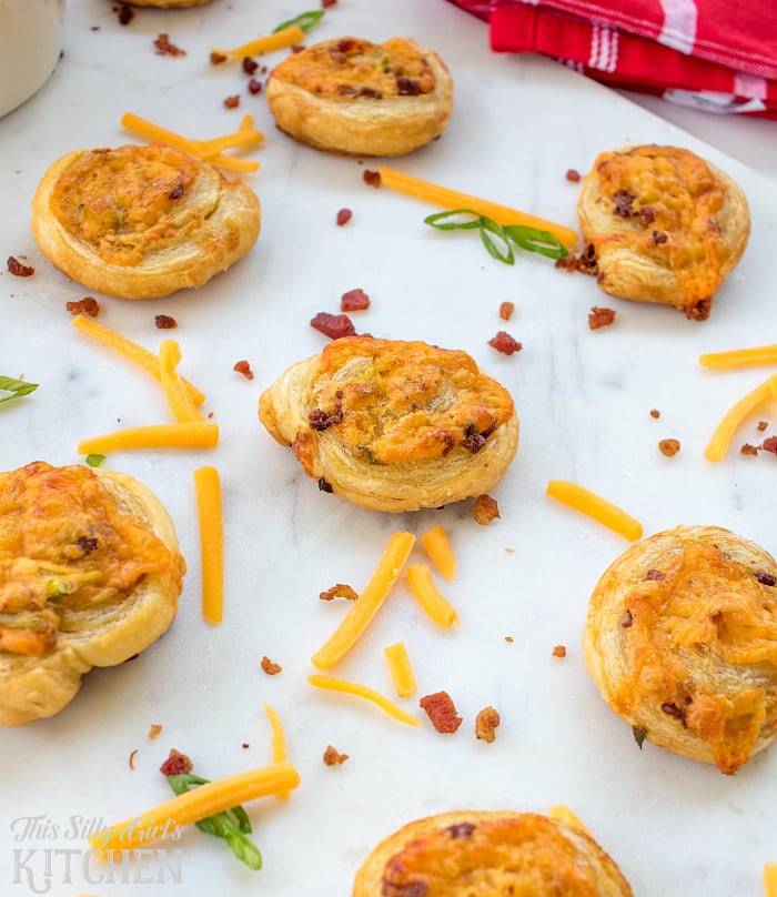Spicy Cheddar Bacon Ranch Pinwheels, crispy puffed pastry bites, made with Sriracha Ranch for a little kick! from ThisSillyGirlsLife.com @HVRanch #RanchEverything Sponsored by Hidden Valley