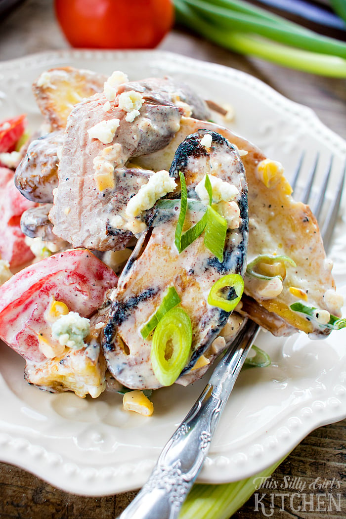 Black and Bleu Potato Salad, blackened flank steak is mixed with grilled potatoes and corn, coated in a luscious bleu cheese dressing! from ThisSillyGirlsLife.com SeeTheLite AD