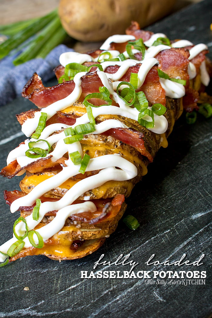 Fully Loaded Hasselback Potatoes, russet potatoes cut and baked until crispy, loaded with cheese and bacon, topped with all the fixings! from ThisSillyGirlsLife.com #JimmyDeanBacon #ad