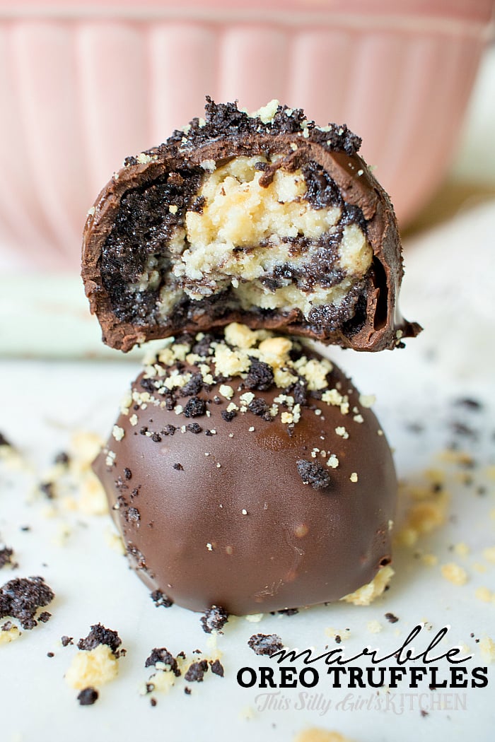 Close up of two stacked oreo truffles with bite taken out of one