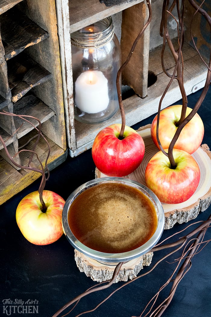 Cinnamon Buttermilk Caramel Sauce Recipe overhead in silver bowl with apples. 