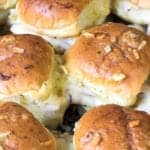 Baked turkey sliders with golden buttered tops fresh out of the oven.