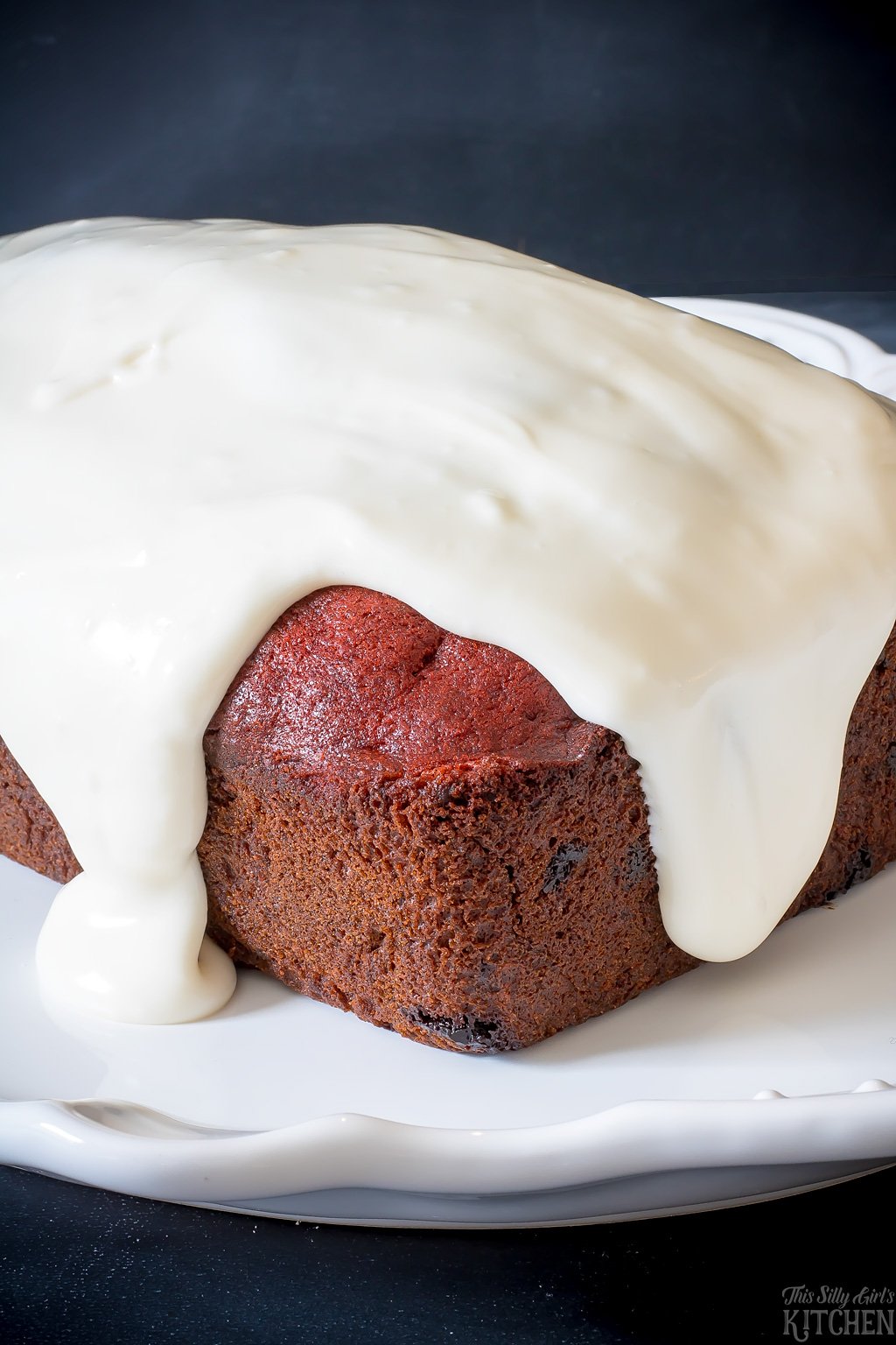 AD Chocolate Chip Red Velvet Banana Bread, classic banana bread and everyone's favorite cake, red velvet in one! Topped with thick cream cheese icing, swoon. from ThisSillyGirlsKitchen.com #groceryhero