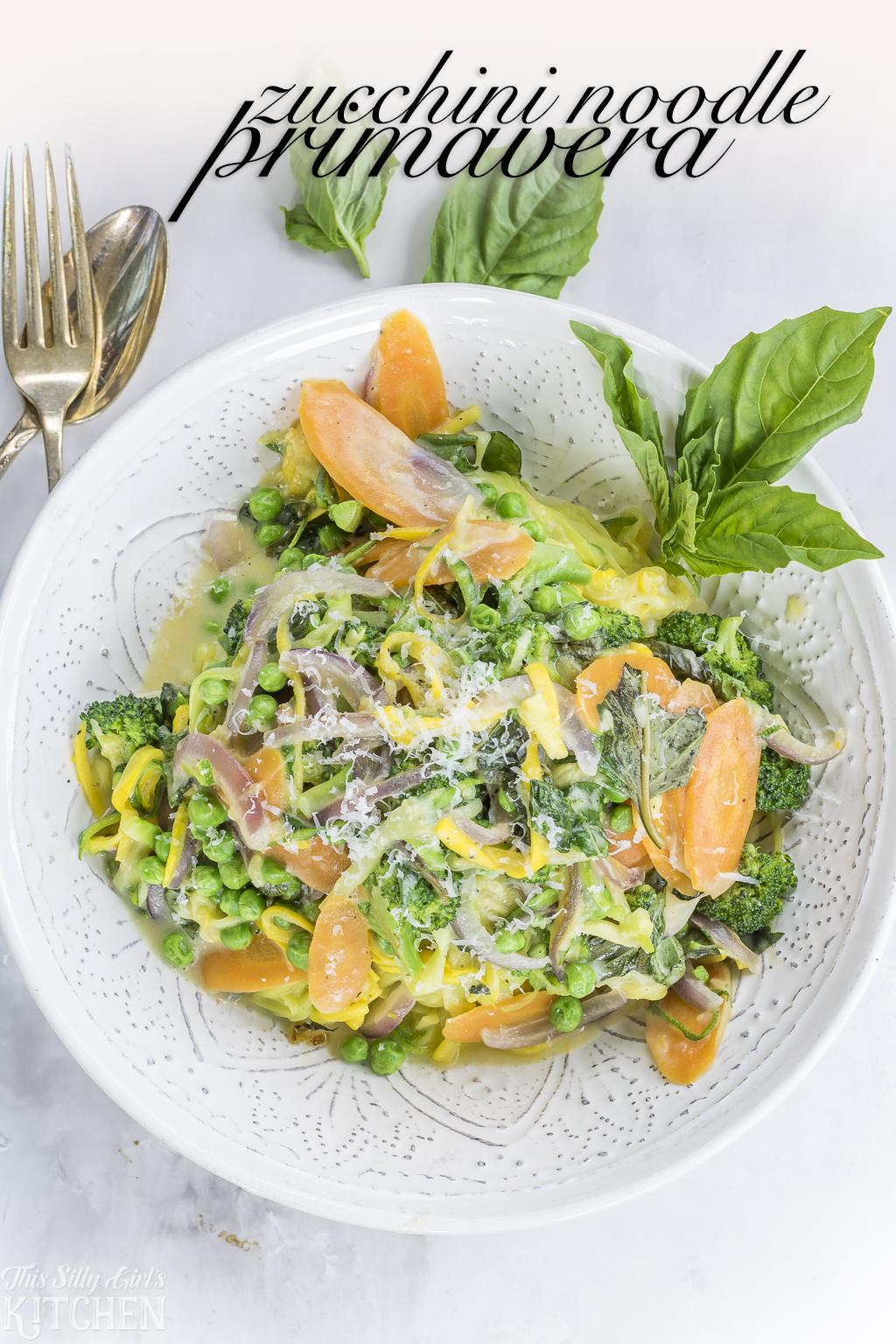 Zucchini Noodle Primavera, a classic pasta dish with a smart twist! Recipe from ThisSillyGirlsKitchen.com