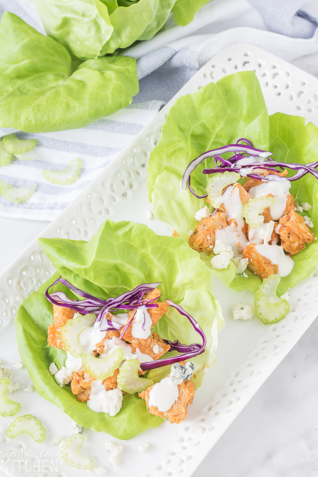 Overhead of two Buffalo Chicken Lettuce Wraps on white tray