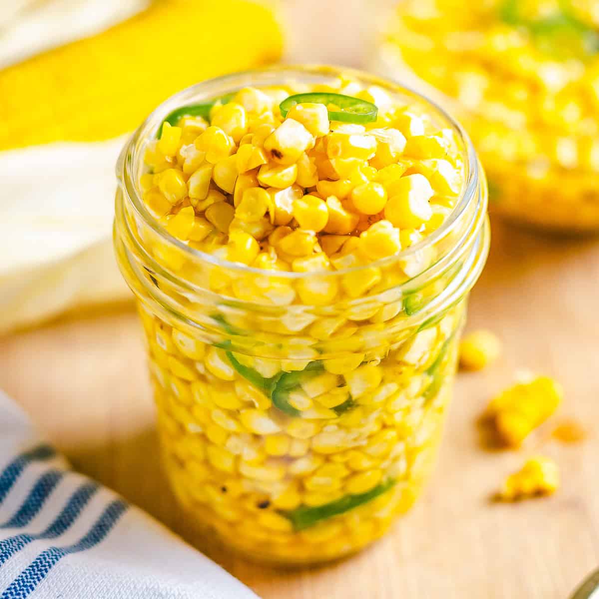 Finished sweet and spicy Corn Relish in a mason jar.