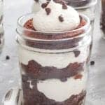 A dr pepper cupcake jar layered with chocolate cake, buttercream, and mini chocolate chips.