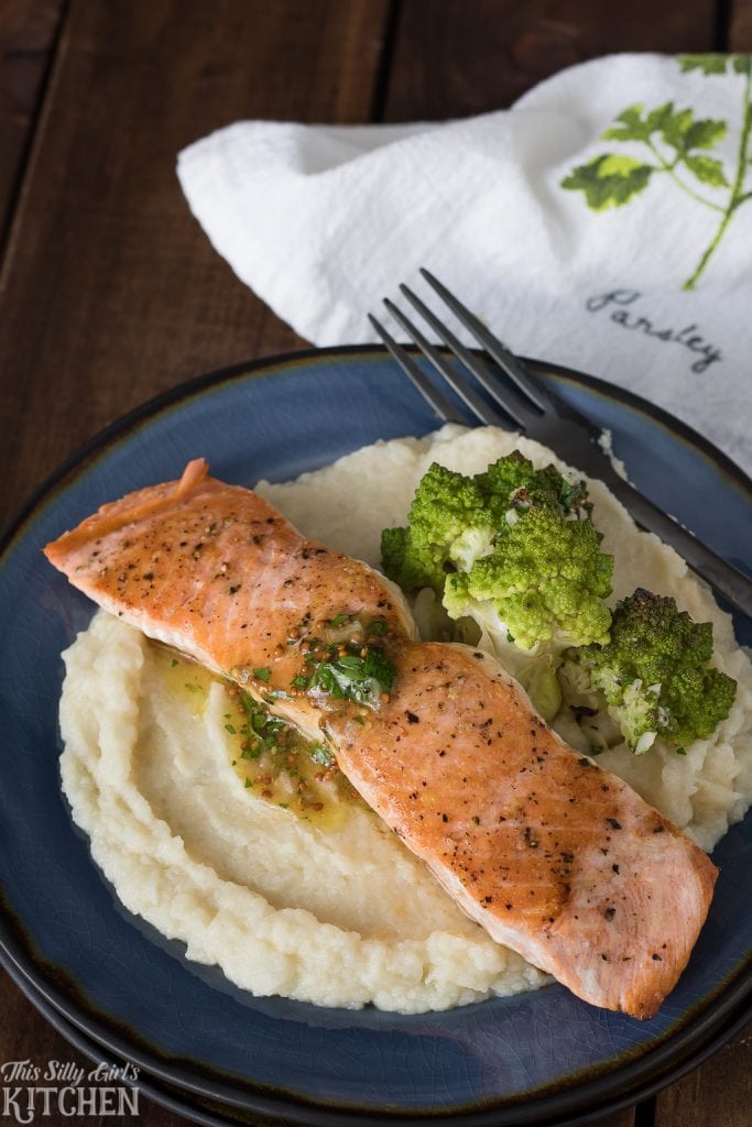 Pan Seared Salmon with Maple Vinaigrette is served over mashed cauliflower, making this dish a great starch alternative. Recipe from ThisSillyGirlsKitchen.com