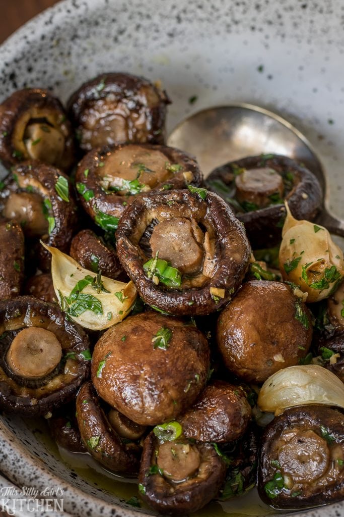 Roasted Mushrooms in a herbaceous garlic butter sauce, steakhouse style! Recipe from ThisSillyGirlsKitchen.com