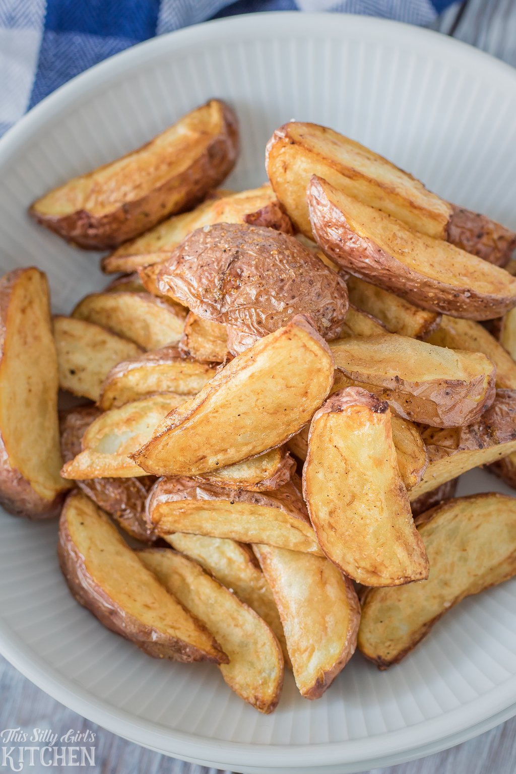 fried potato wedges in a white bowl