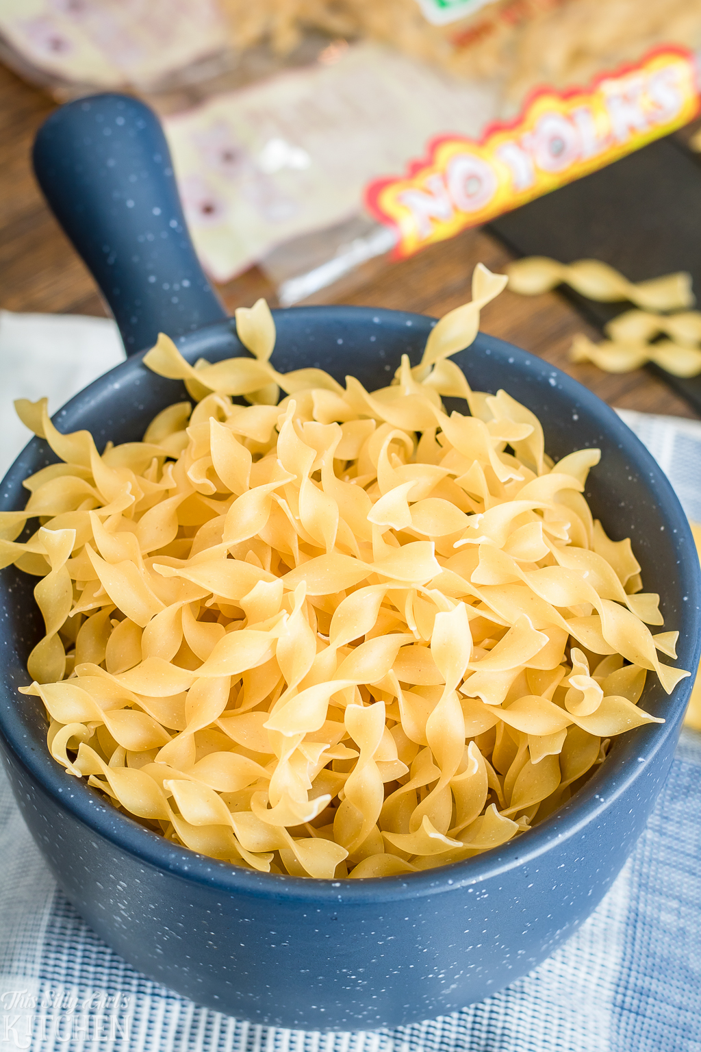 Close up of bowl of uncooked egg noodles