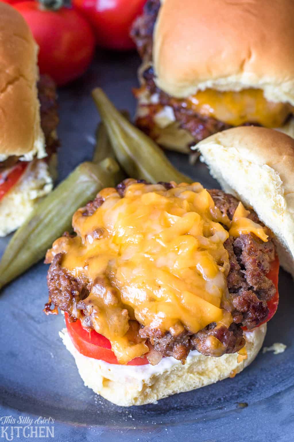 Overhead of Cheeseburger Sliders with melted cheese and top of bun off