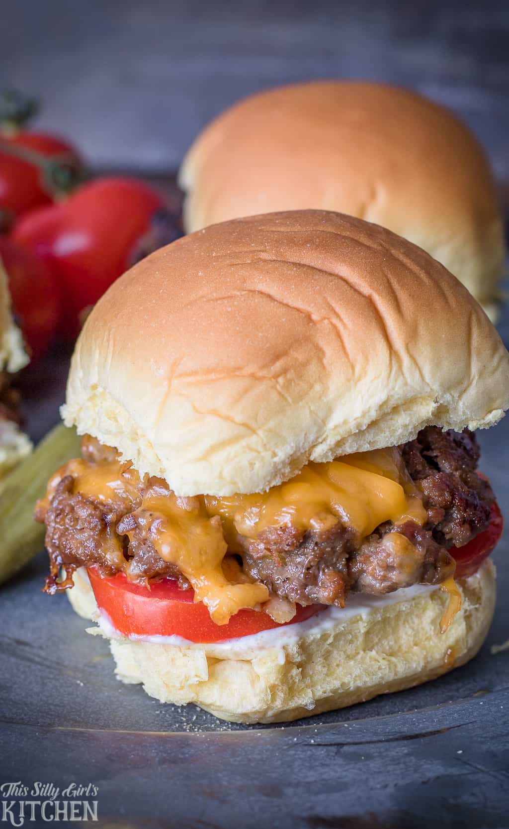 Melted cheese and tomato on Cheeseburger Sliders 