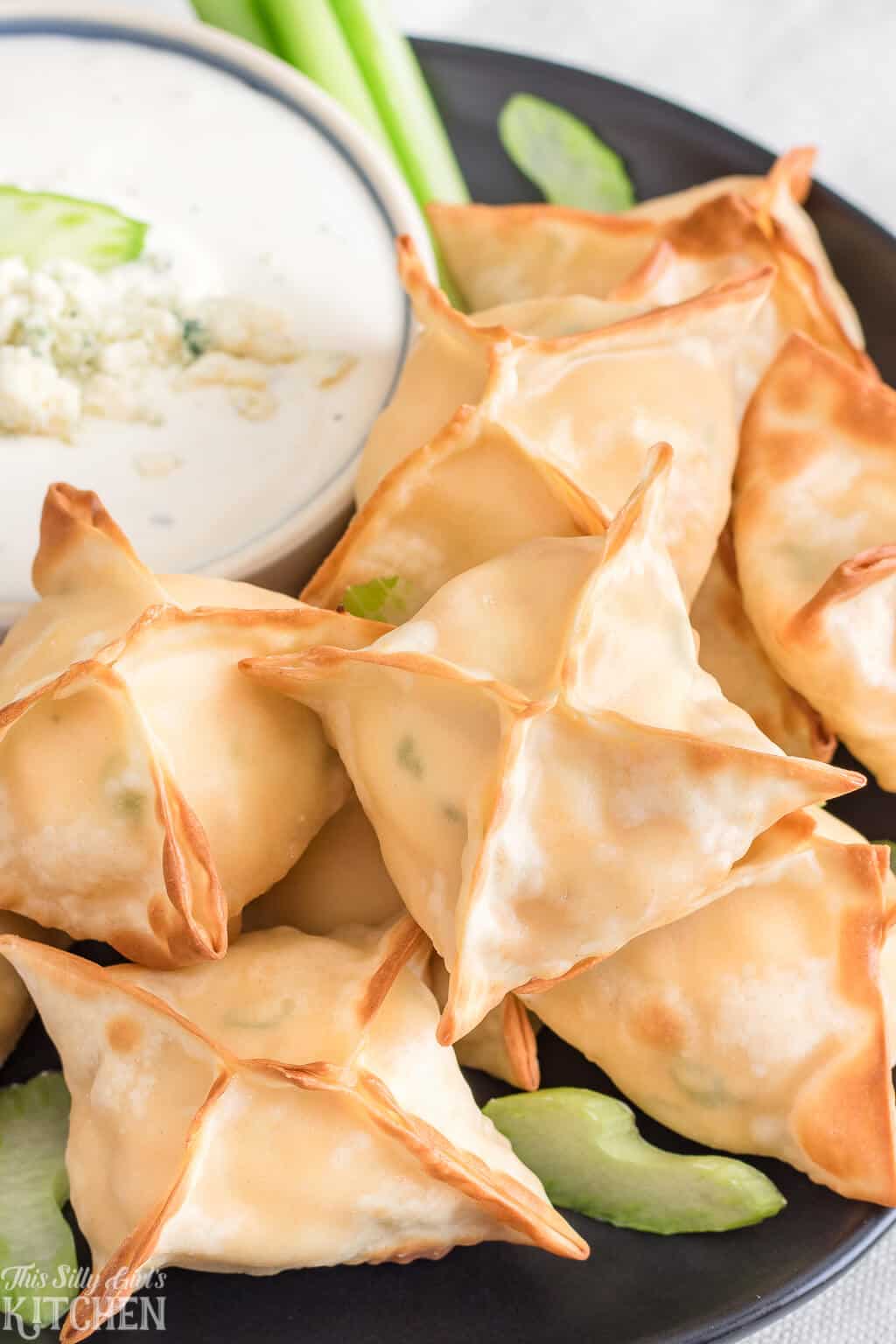 Buffalo Chicken Wontons, only 6 ingredients and ready in 15 minutes, perfect for game day! #Recipe from ThisSillyGirlsKitchen.com #buffalochicken #wontons #airfryer