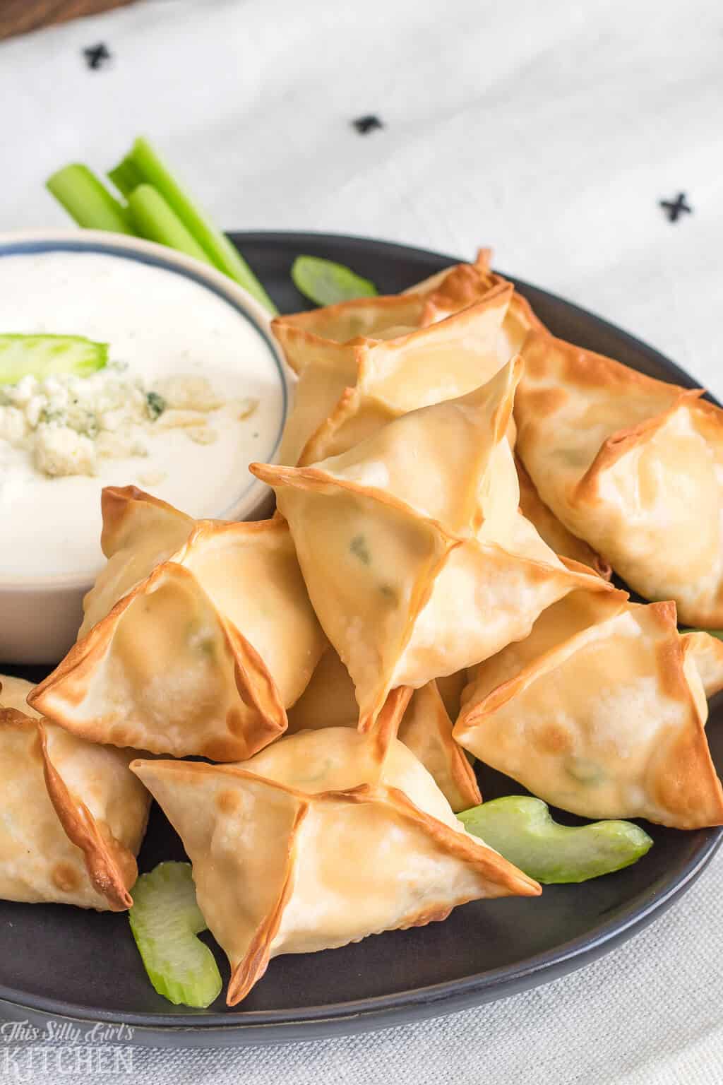 AirFryer Buffalo Chicken Wontons, only 6 ingredients and ready in 15 minutes, perfect for game day! #Recipe from ThisSillyGirlsKitchen.com #buffalochicken #wontons #airfryer