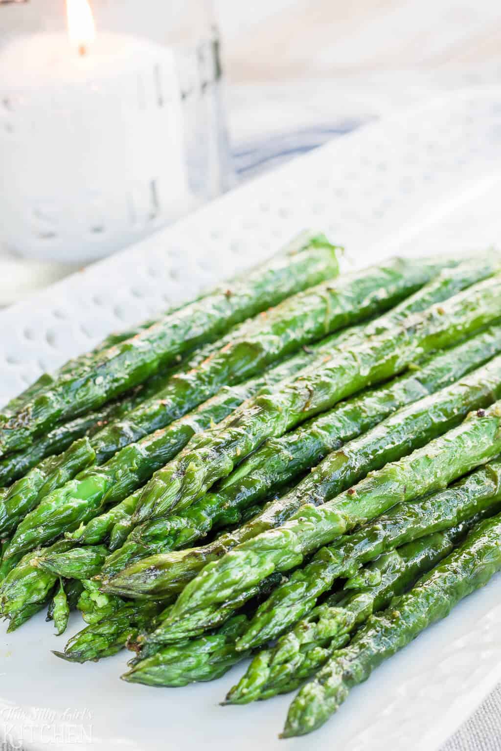 Grilled Asparagus, made with 5 simple ingredients and ready in under 15 minutes! #Recipe from ThisSillyGirlsKitchen.com #asparagus #grilledasparagus