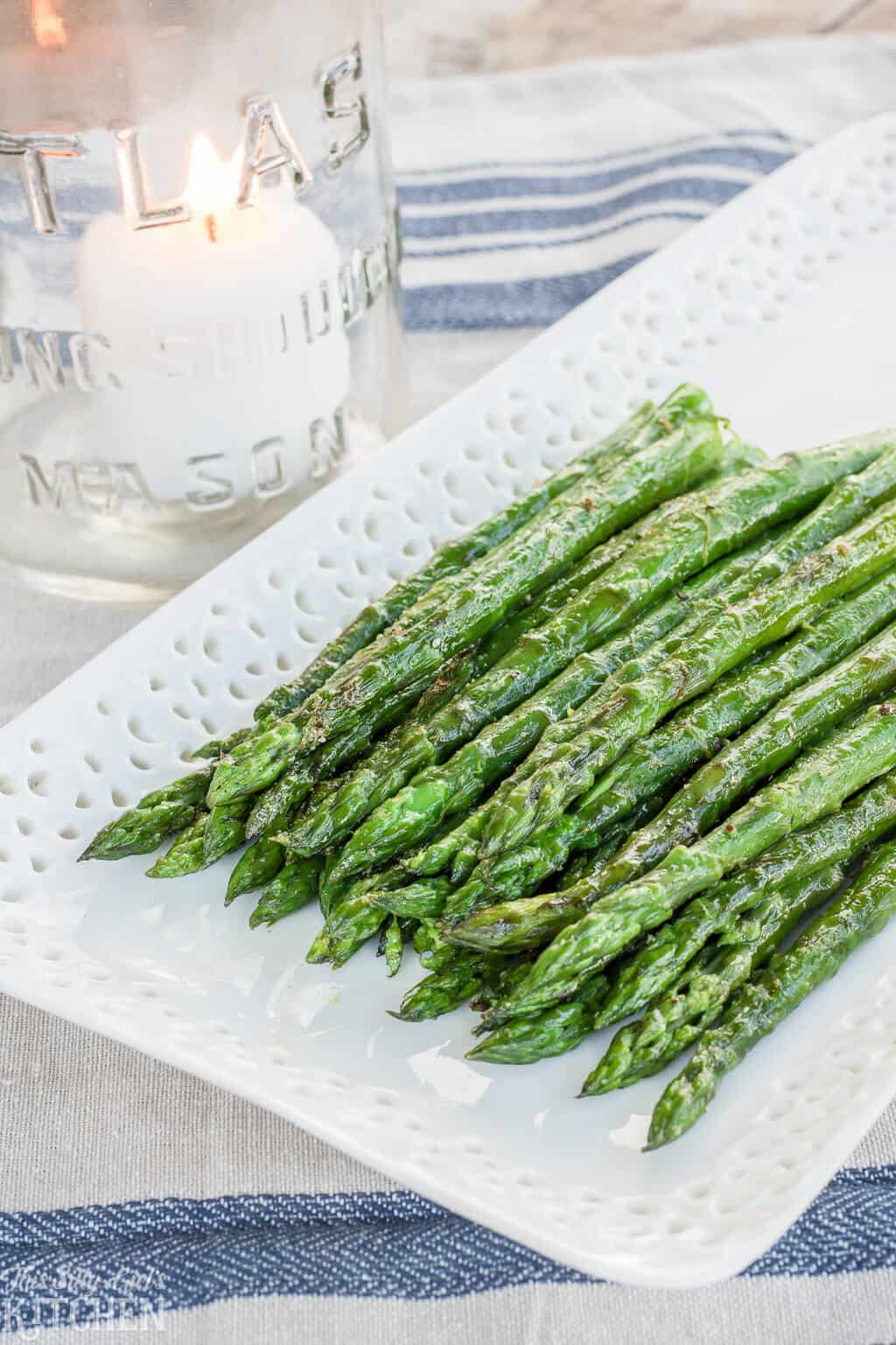 The Best Grilled Asparagus Recipe, made with 5 simple ingredients and ready in under 15 minutes! #Recipe from ThisSillyGirlsKitchen.com #asparagus #grilledasparagus