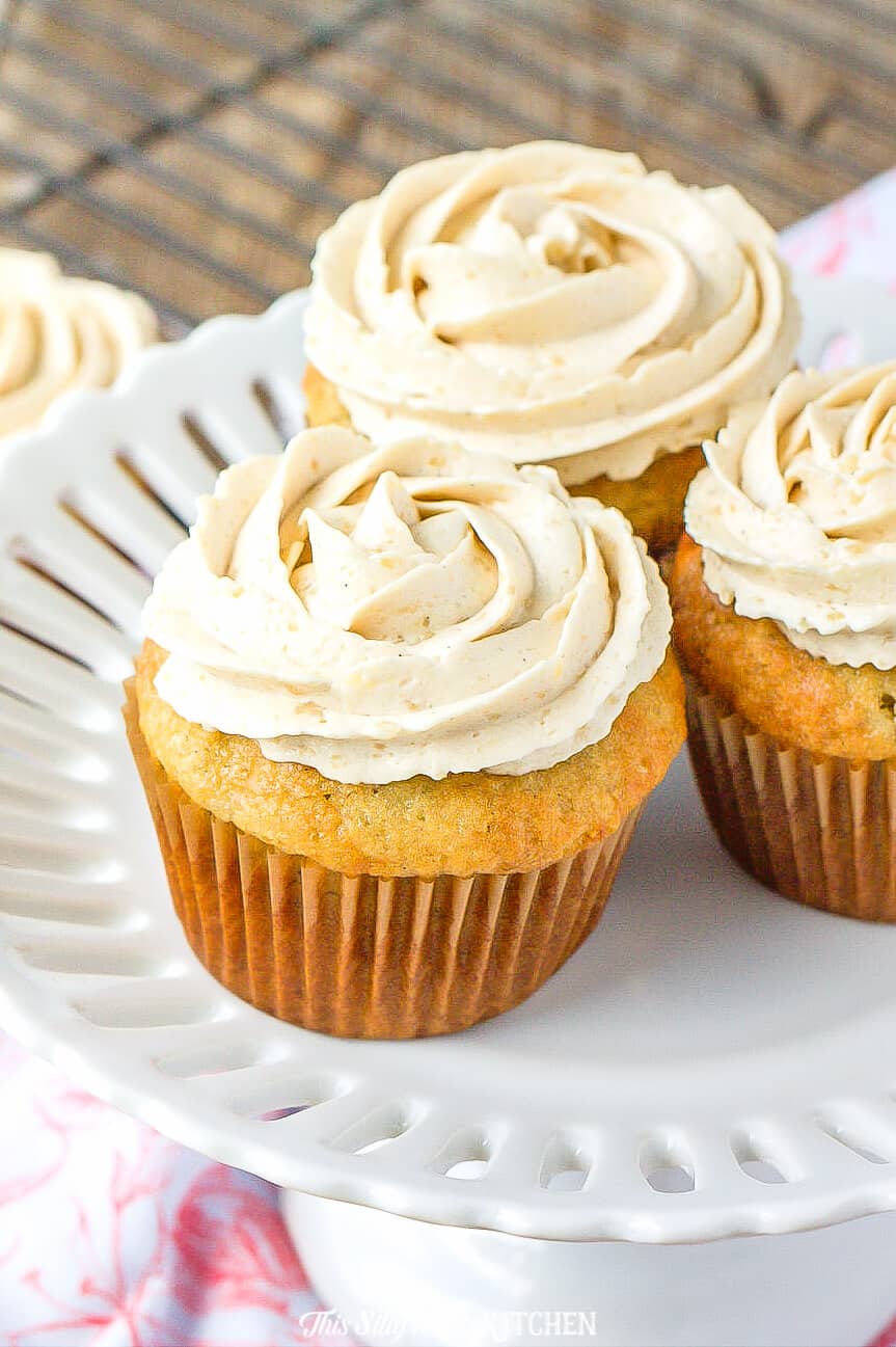 Banana Cupcakes, light, moist cupcakes topped with THE BEST brown sugar frosting. #recipe from thissillygirlskitchen.com #bananacupcakes #brownsugarfrosting #cupcakefrosting #cupcakes