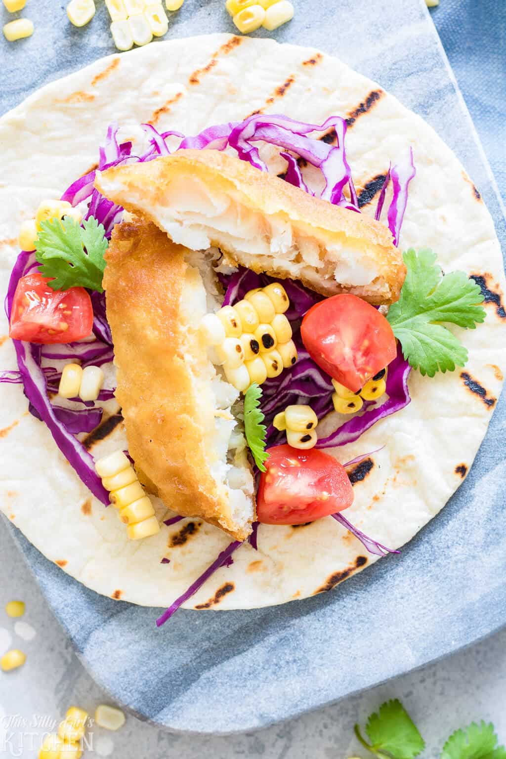 Easy Fish Tacos with Creamy Chimichurri Sauce, an easy weeknight meal you will make again and again! #Recipe from ThisSillyGirlsKitchen.com #fishtaco #taco #chimichurri
