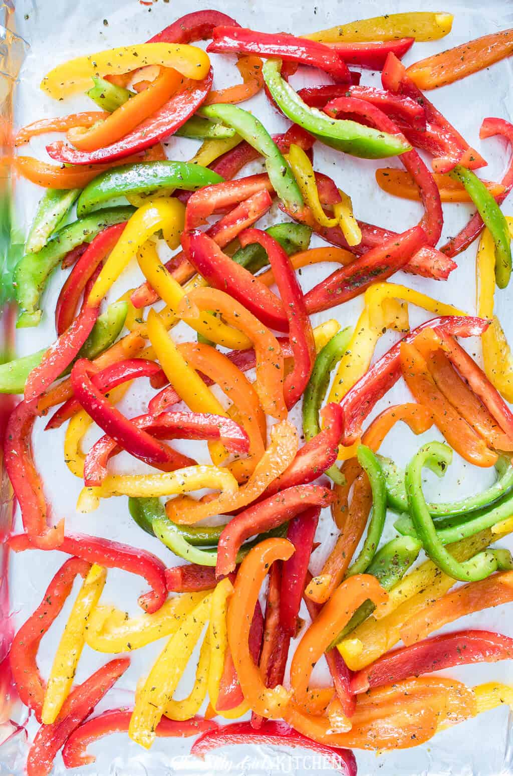 Roasted peppers make for a side dish or topping for many different meals. #recipe from ThisSillyGirlsKitchen.com #roastedpeppers #roastedredpepper #bellpepper #sidedish 