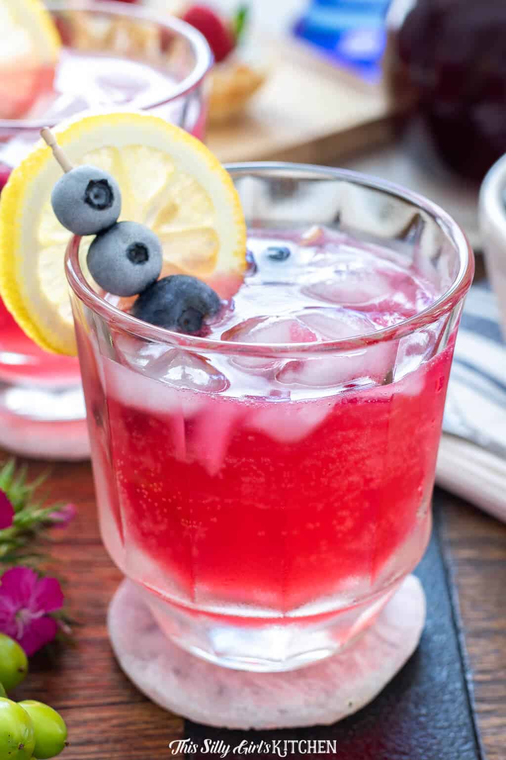 blueberry vodka lemonade on a small coaster