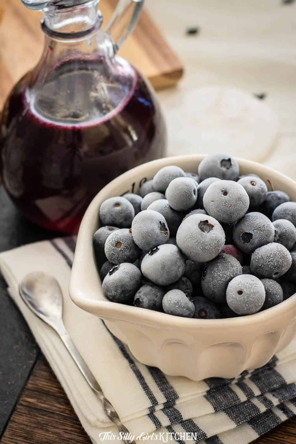 frozen blueberries in a measuring cup