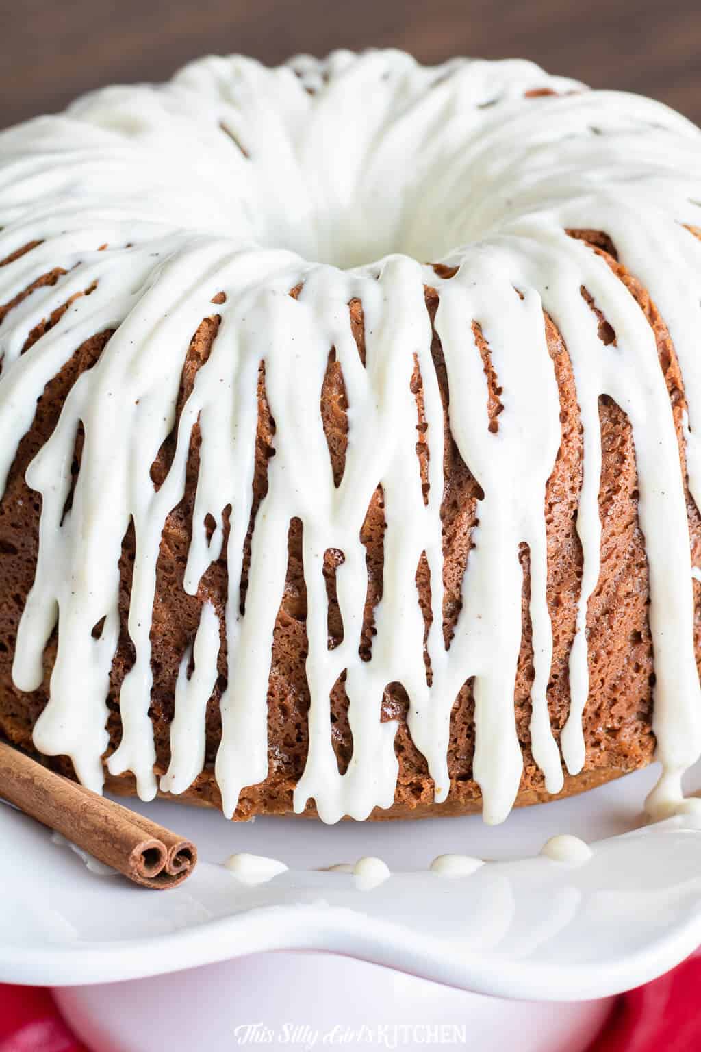 Close up of glaze dripping down sides of bundt cake