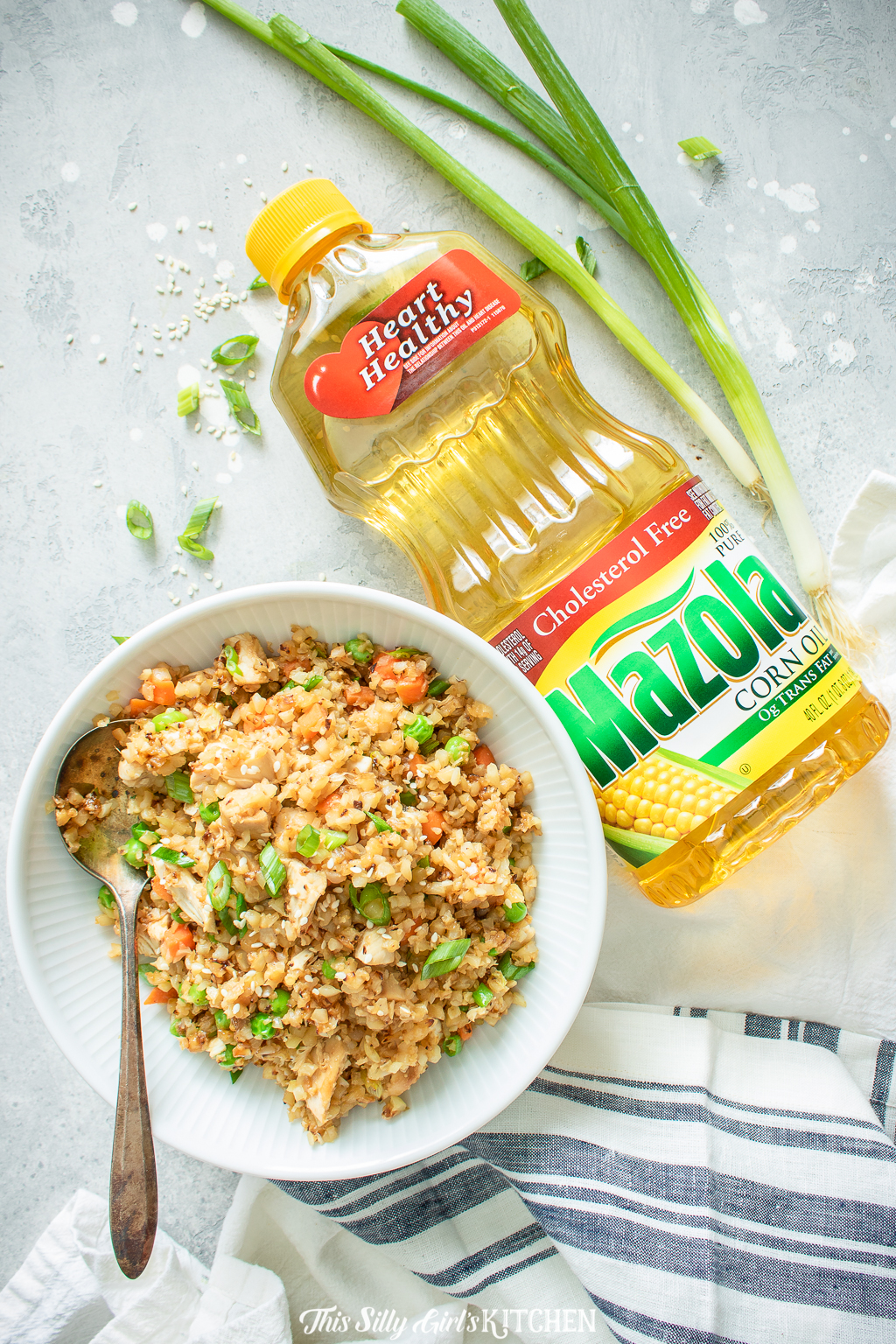 Loaded with veggies and chicken this&nbsp;cauliflower chicken fried rice is a healthier alternative to classic fried rice. #recipe from thissillygirlskitchen.com #friedrice #chicken #chickenfriedrice #cauliflowerrice