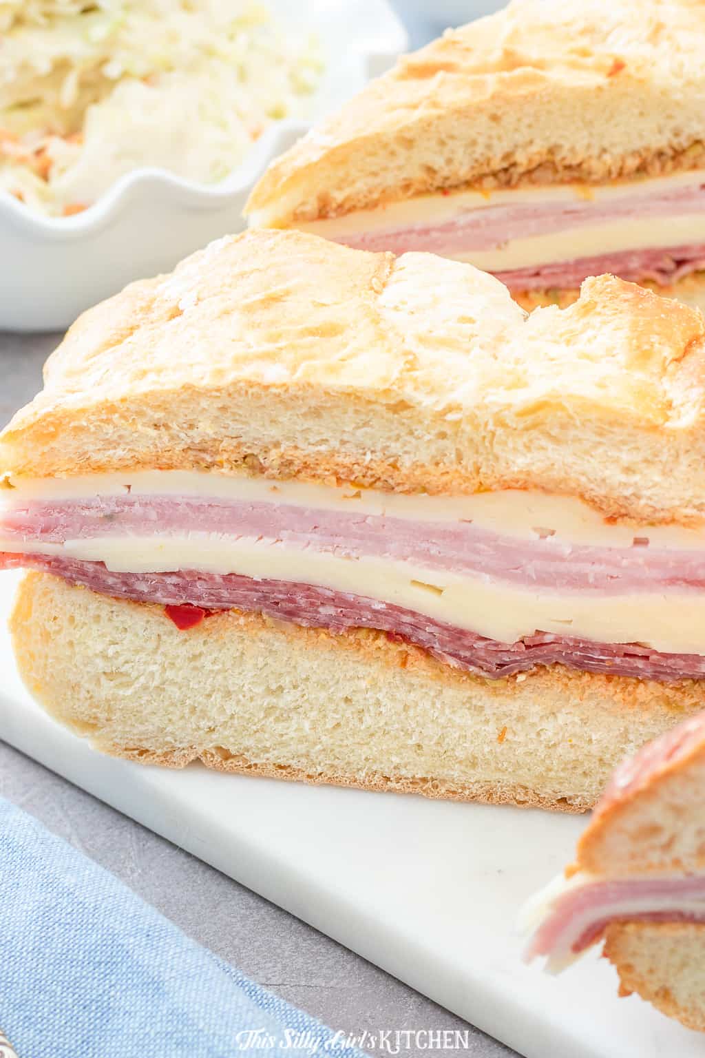 This recipe for the muffaletta is an easy version, perfect for make-ahead lunches! #recipe from ThisSillyGirlsKitchen.com #muffaletta #muffuletta #sandwich #lunch