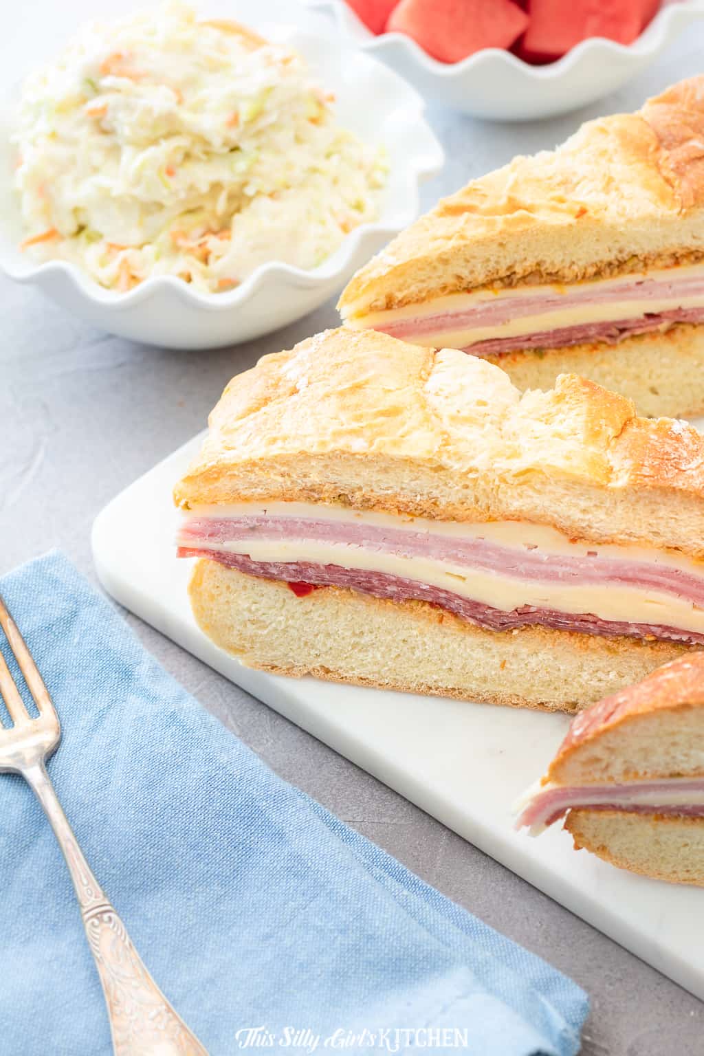 This recipe for the muffaletta is an easy version, perfect for make-ahead lunches! #recipe from ThisSillyGirlsKitchen.com #muffaletta #muffuletta #sandwich #lunch