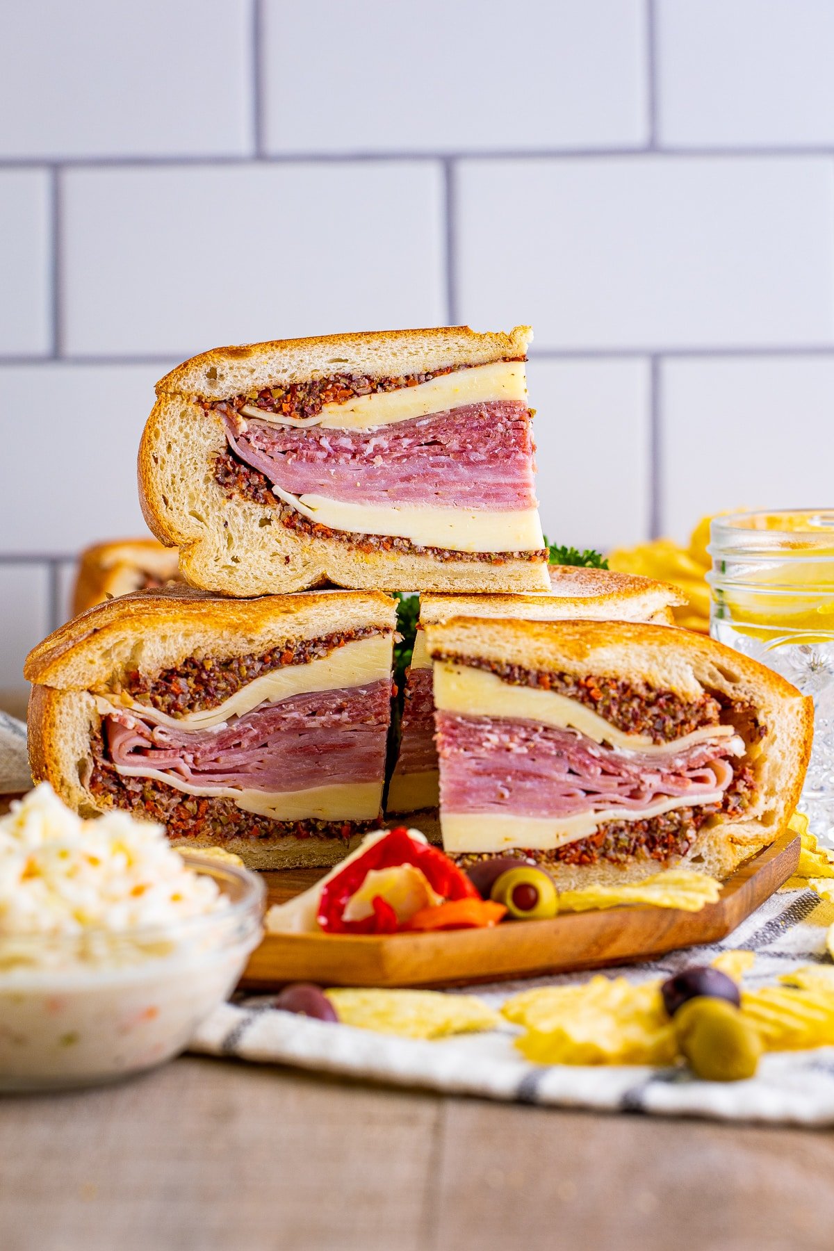 Muffuletta cut and stacked showing layers.