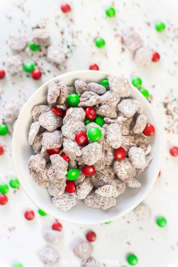Reindeer Chow AKA Muddy Buddies with a Holiday twist! #recipe from thissillygirlskitchen.com #reindeerchow #muddybuddies #puppychow #holiday #christmasdesserts #christmas