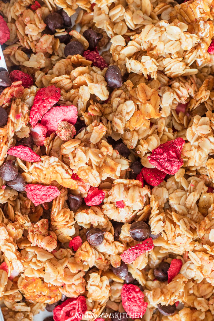 This homemade granola is extra special, the addition of freeze dried strawberries and dark chocolate chips really sets it apart. #recipe from thissillygirlskitchen.com #granola #homemadegranola #breakfast #strawberrygranola #chocolategranola