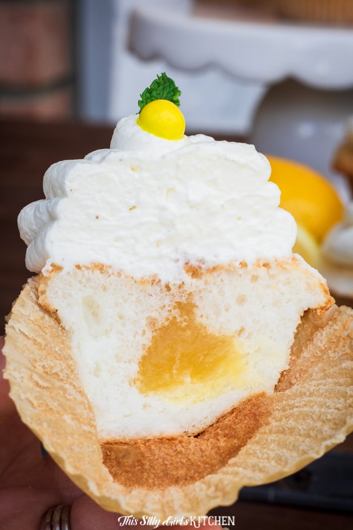 One Lemon Cupcake cut in half showing filling 