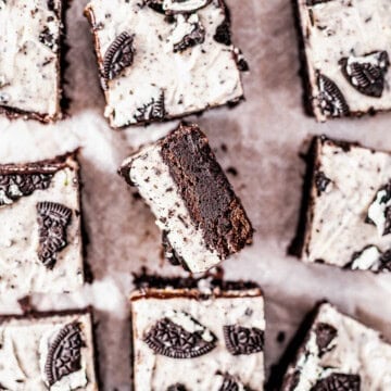 Square image overhead showing one brownie on its side showing layers.