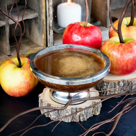 Cinnamon Buttermilk Caramel Sauce in silver bowl with apples square image.