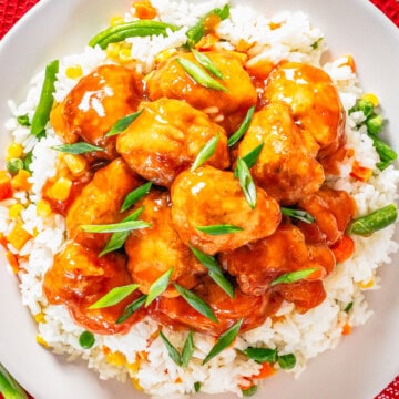 Square photo of finished chicken over rice.