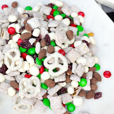 Overhead close up Christmas Trail Mix on white plate square image