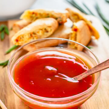 Spoon in bowl of The Best Sweet and Sour Sauce.