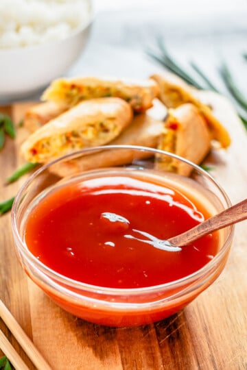 Spoon in bowl of The Best Sweet and Sour Sauce.