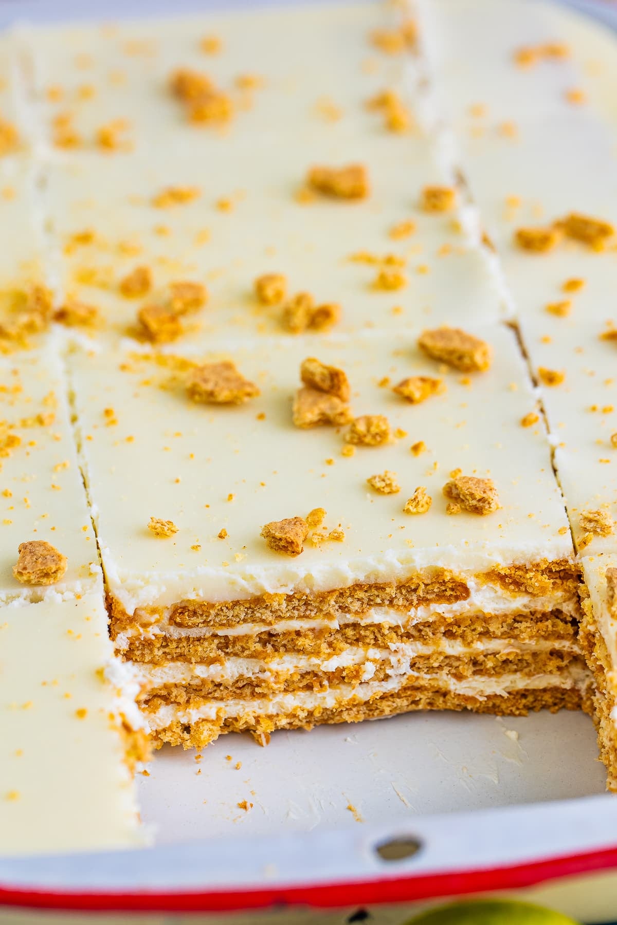 Eclair Cake in the pan with a slice taken out