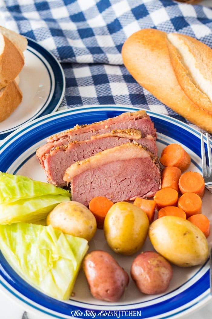 Close up of plated Slow Cooker Corned Beef Dinner with bread