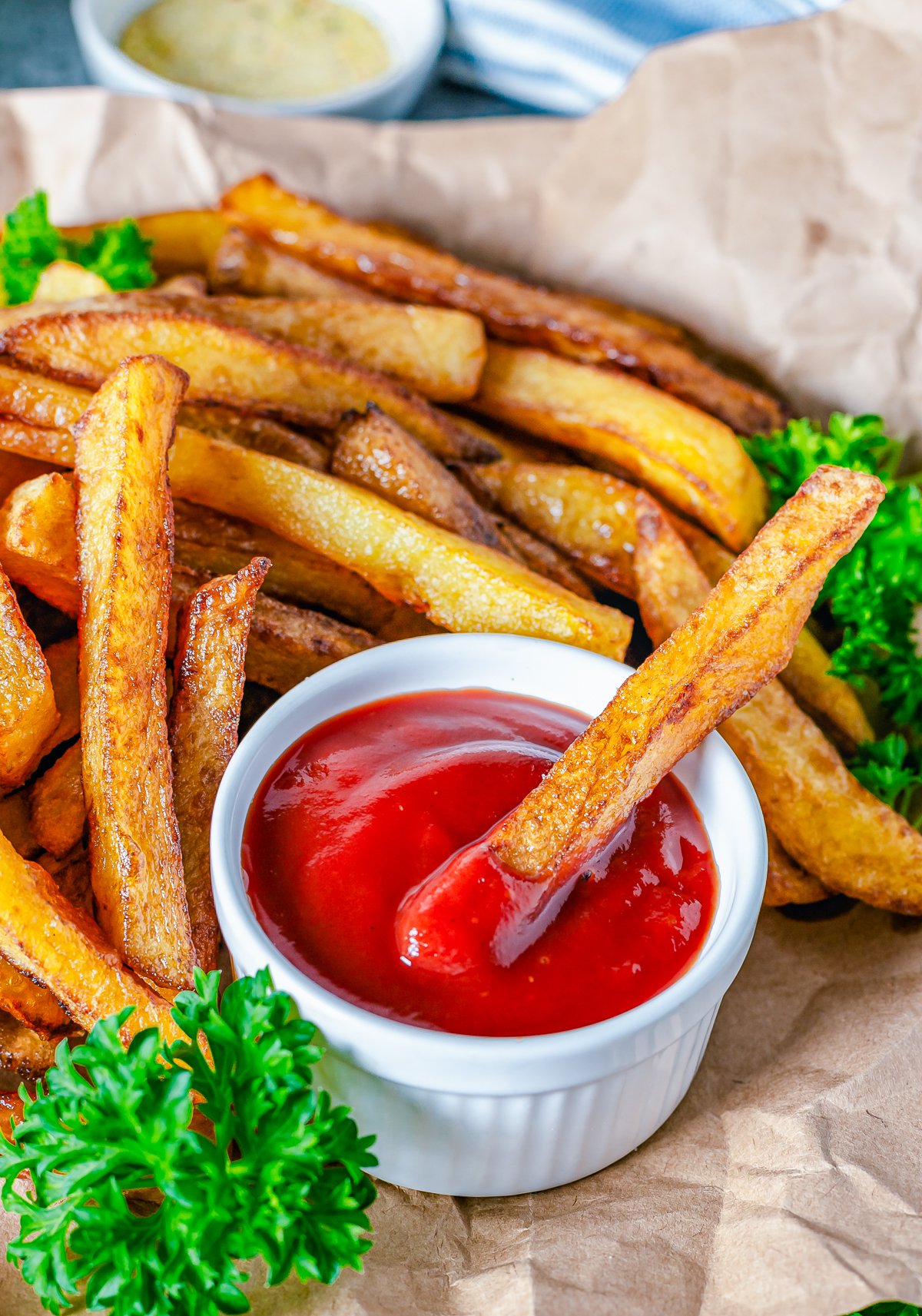 One french fry dipped in ketchup.