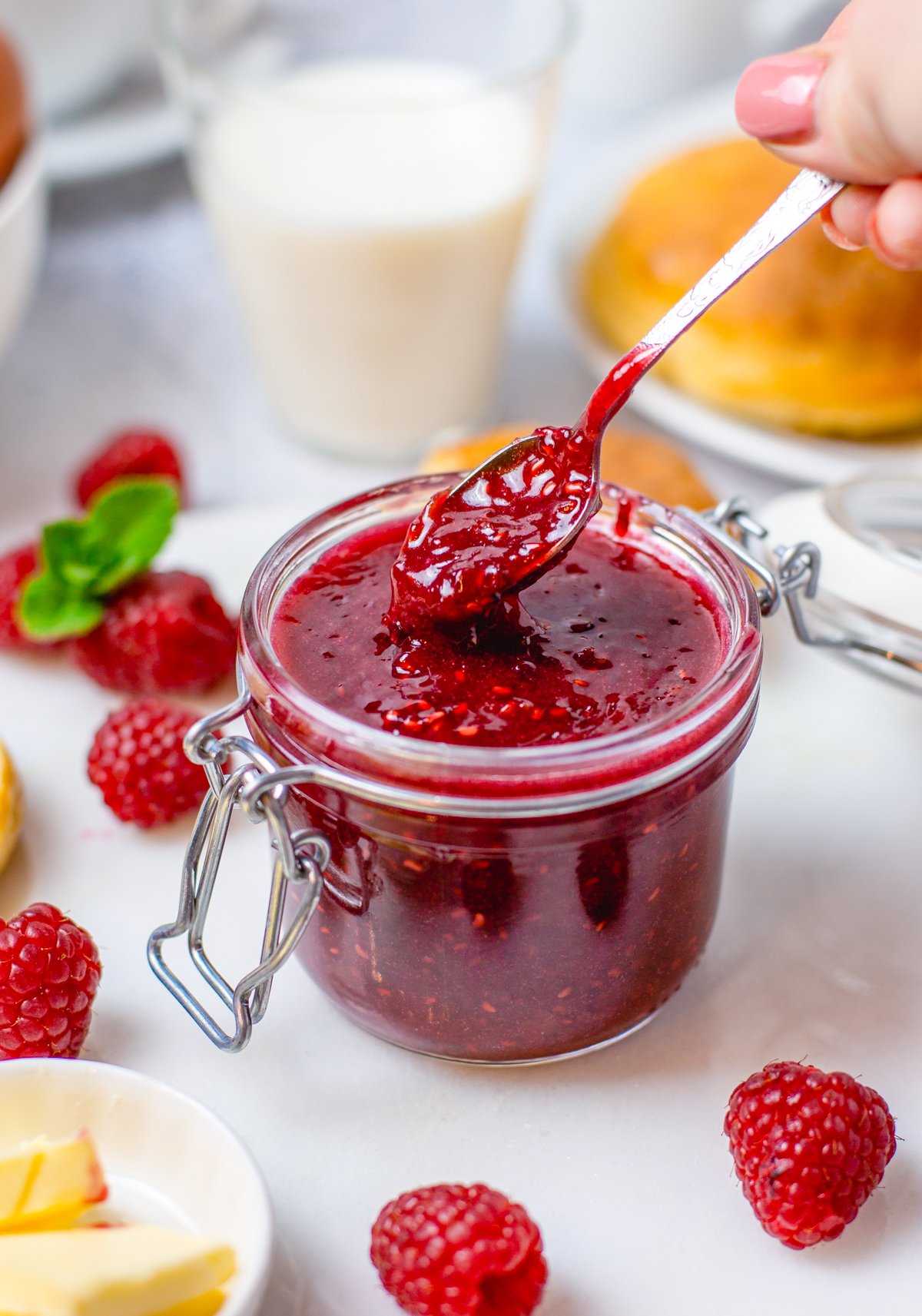Spoon holding up some Raspberry Curd