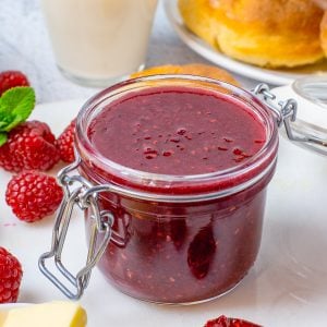 Close up square image of Raspberry Curd in jar