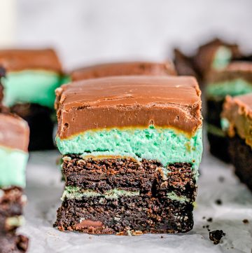 A Mint Brownie square showing the fudgy brownie, green mint frosting, and chocolate fudge layers.