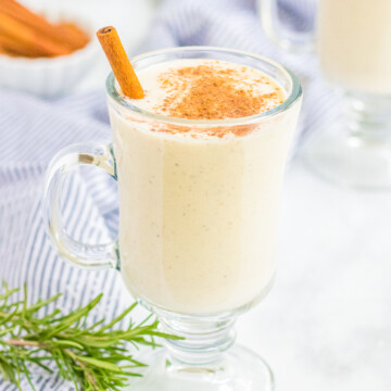 Glass of Classic Eggnog with cinnamon and cinnamon stick