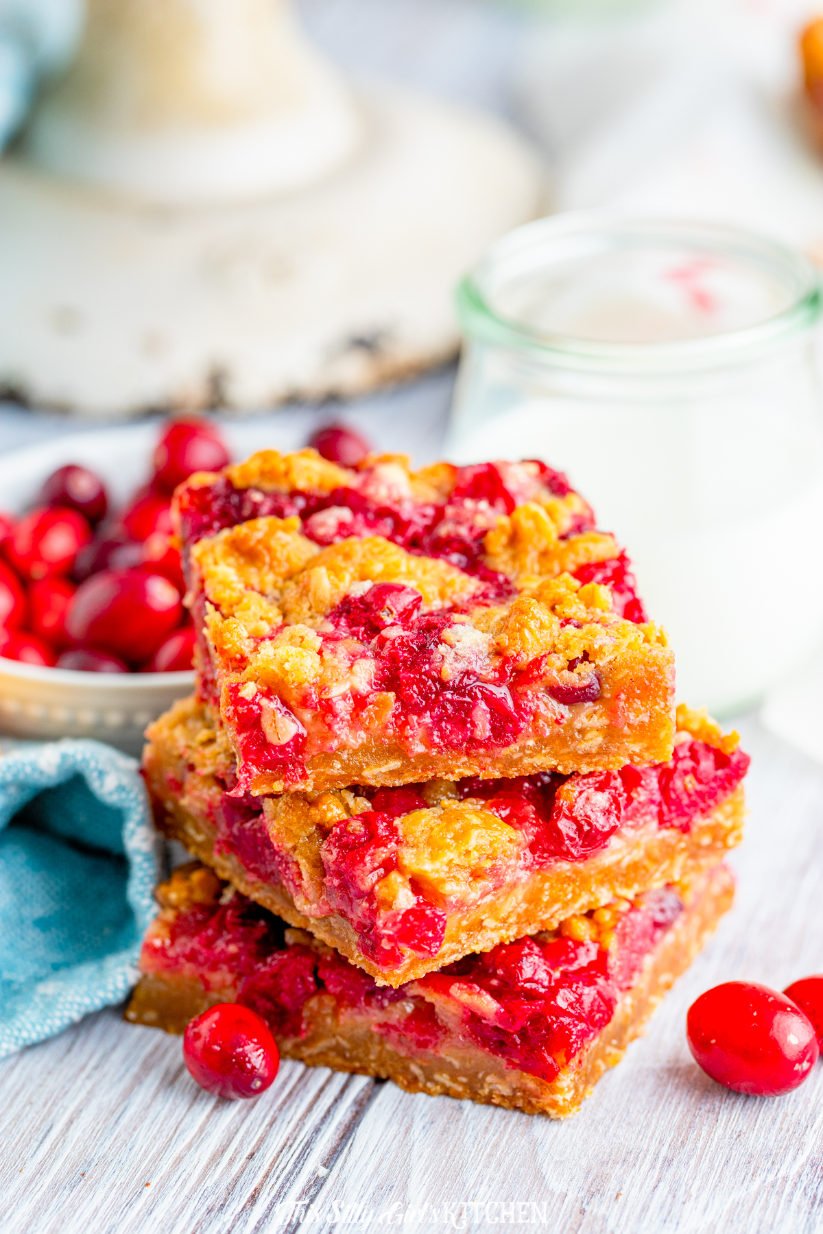 Three Cranberry Pie Bars stacked on top of one another