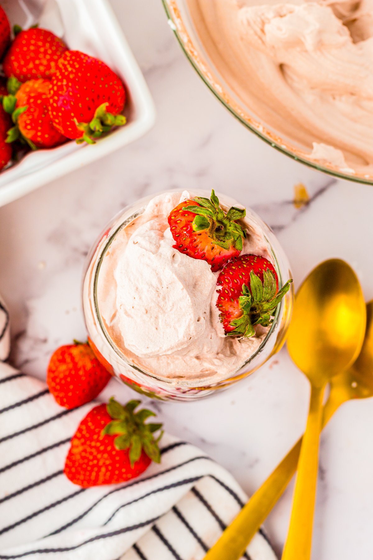 Overhead photo of Chocolate Whipped Cream with strawberries.